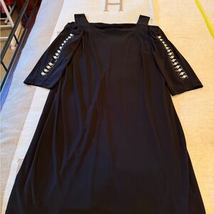 Elegant Black Dress with Unique Pearl Sleeve Design